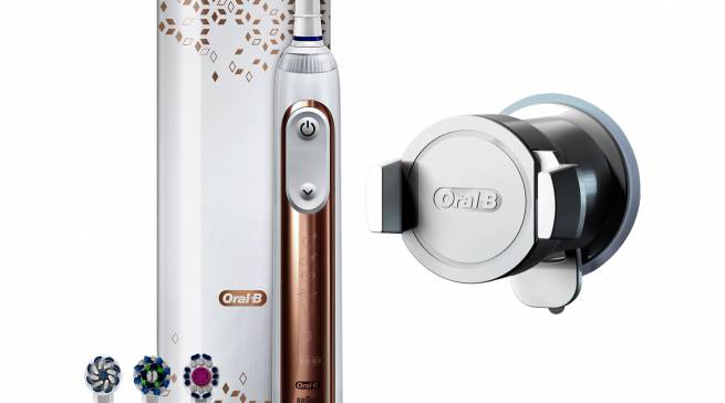 Oral-B Zahnbürste Genius 9000 Roségold in Rosatönen und goldenem Schimmer.